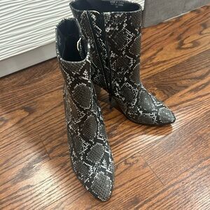 Heeled snakeskin booties